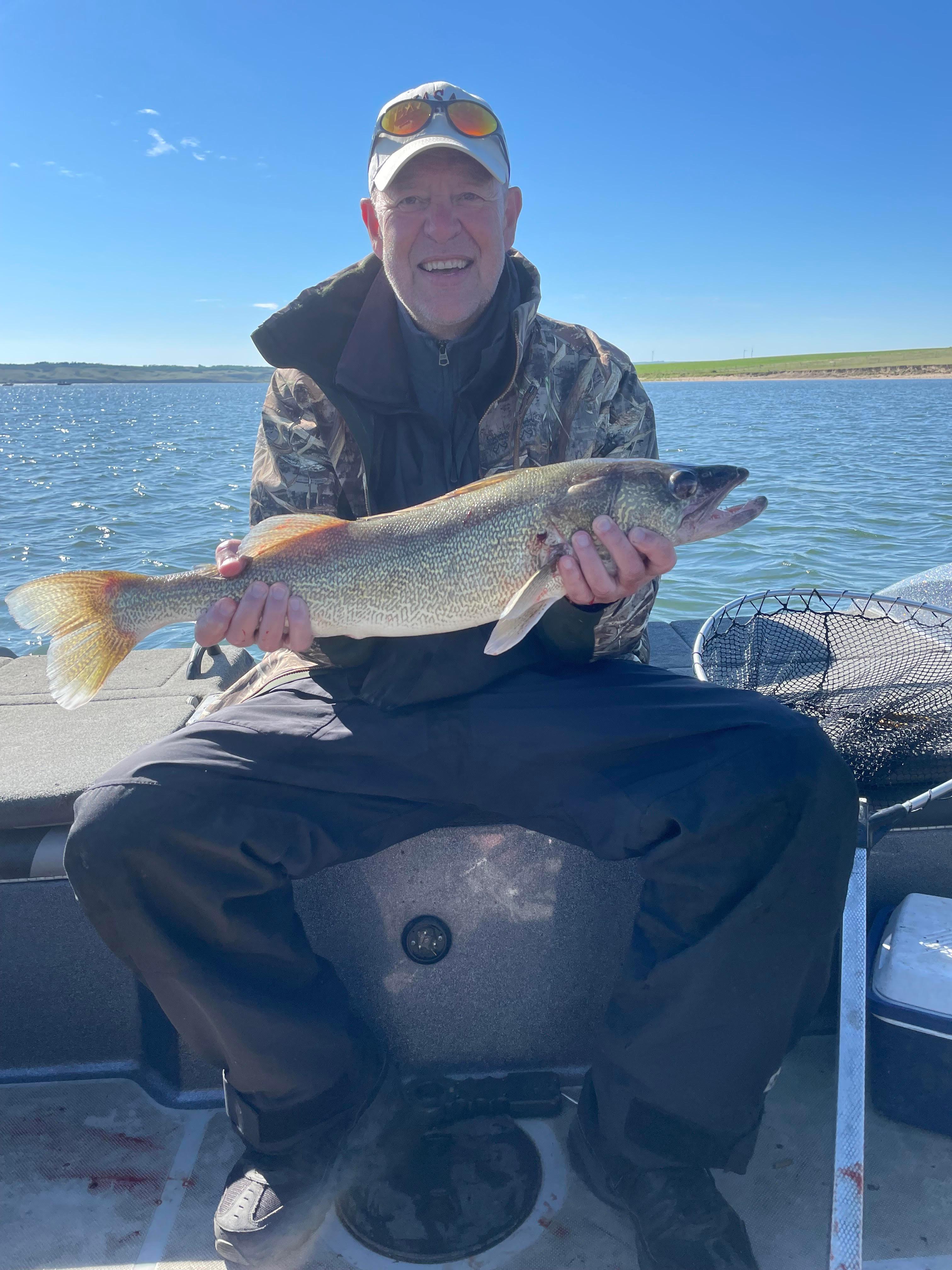 Robert Brown holding a fish he caught